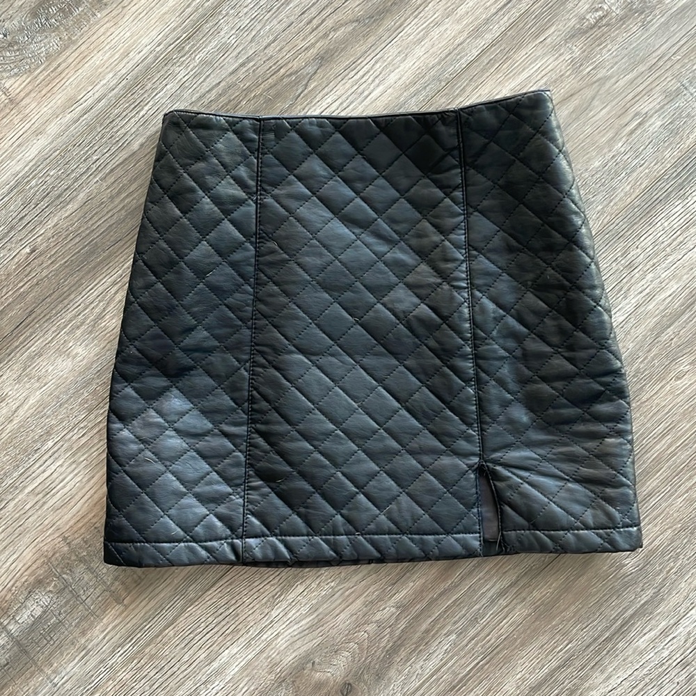 Leather black quilted skirt with slit